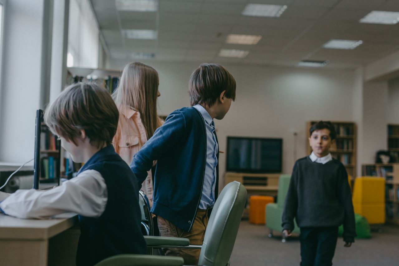 Young students in a modern classroom environment engaging in educational activities.